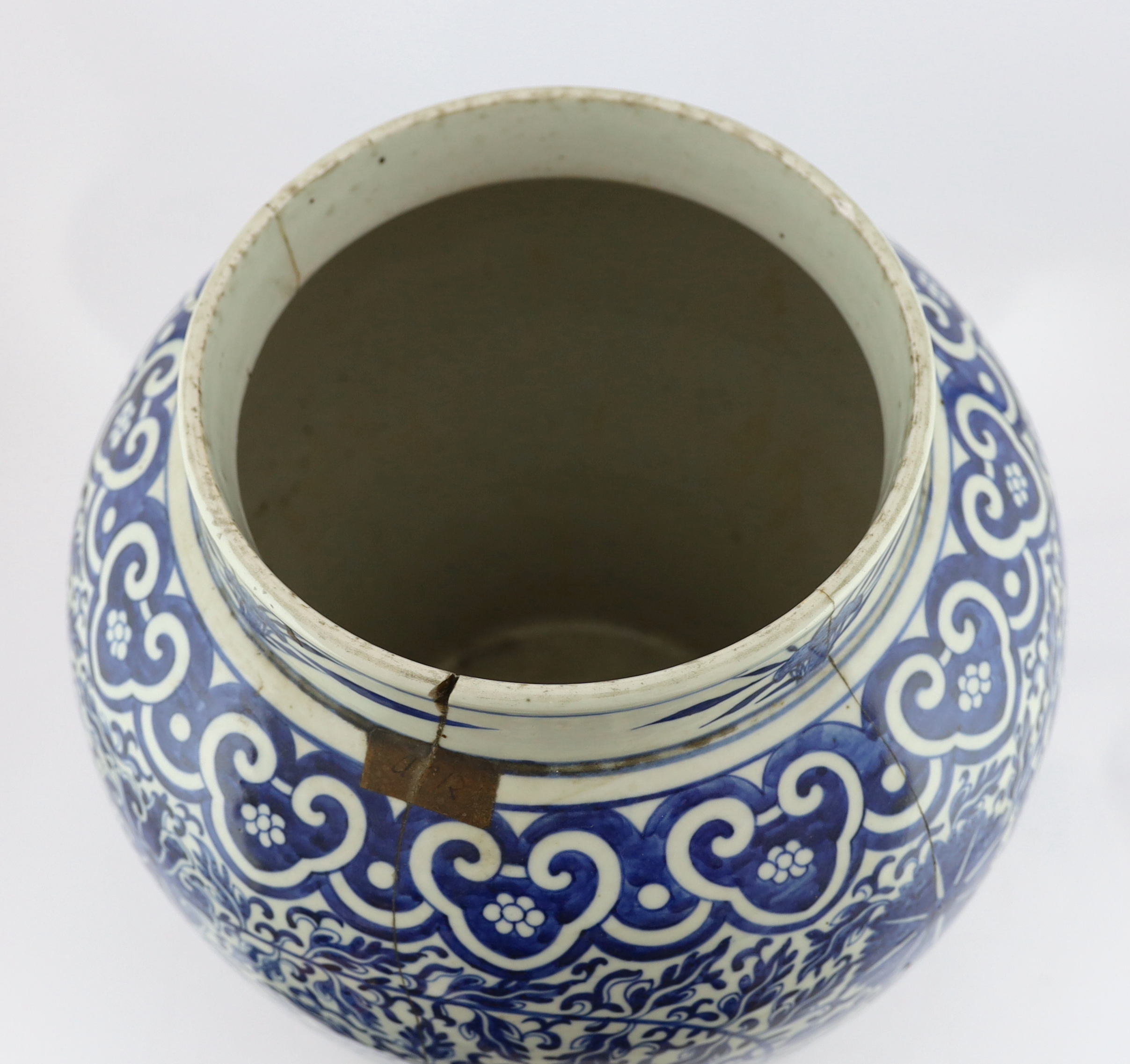 A massive Chinese blue and white ‘lotus’ vase and cover, 18th/19th century, broken and glued